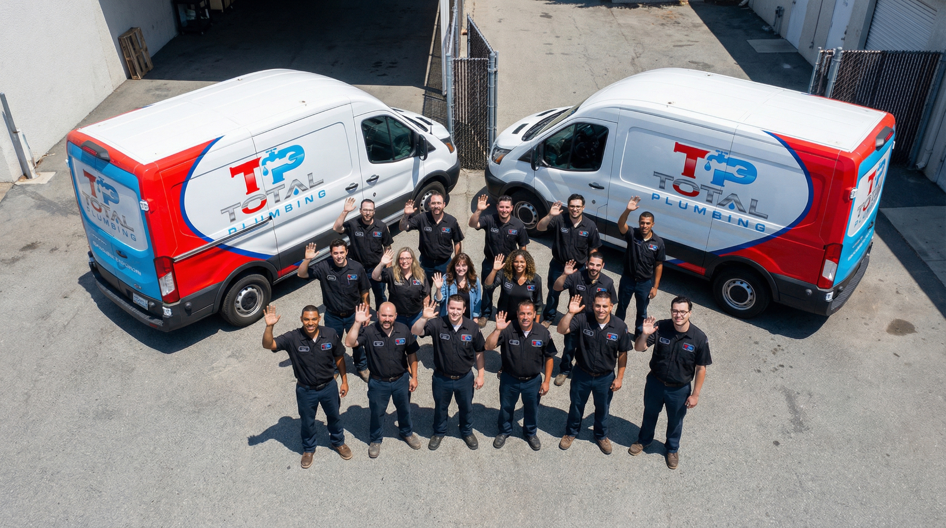 Total Plumbing team with service vans